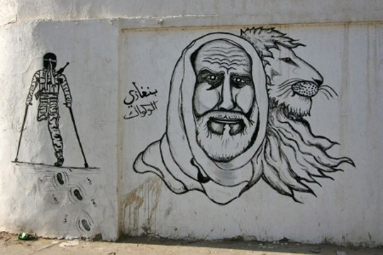 //Omar Al-Mukhtar is a popular resistance hero who was hanged by the Italian colonialists in 1931. During the Gaddafi regime, he was omitted from national history and never mentioned in history text books in school. Today, his portrait can be seen everywhere in Benghazi.