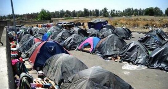 //A camp of sub-Saharan migrants in Boufarik, near Algiers / AFP