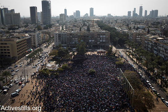 //More than 30,000 thousands African asylum seekers participate in a protest calling to free all African refugees imprisoned in Israeli prisons and detention centers and calling for the recognition of all refugees rights, Tel Aviv, Israel, on January 5, 2014. The protest was the first event in a 3-day general strike of African asylum seekers in Israel, and is the biggest African refugees protest in Israel’s history.