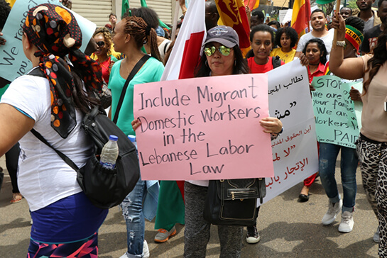 //A migrant worker from the Philippines participating in a march in Beirut organised by the Anti-Racism Movement (Anti-Racism Movement)