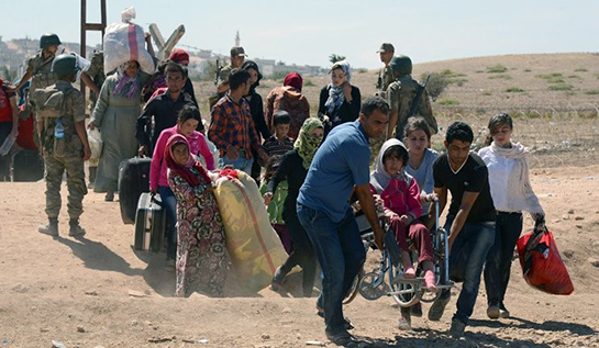 //Syrian refugees fleeing to Turkey. (Photo: AP)
